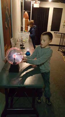 student with light ball